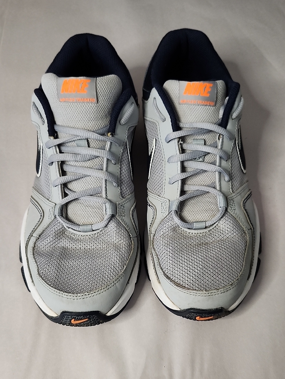 Nike Light Gray and Navy Running Shoes with Orange Logo